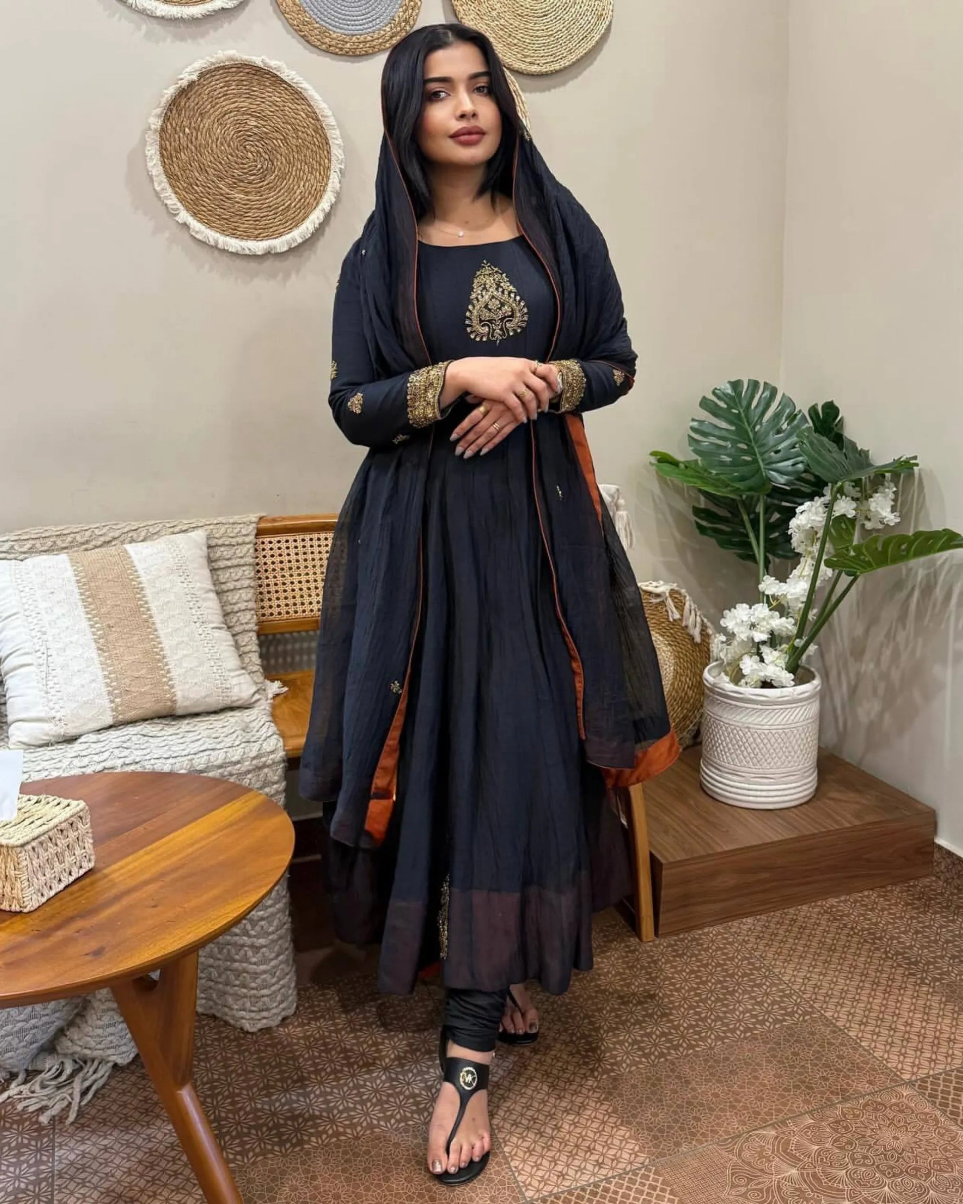 Woman in a black traditional outfit