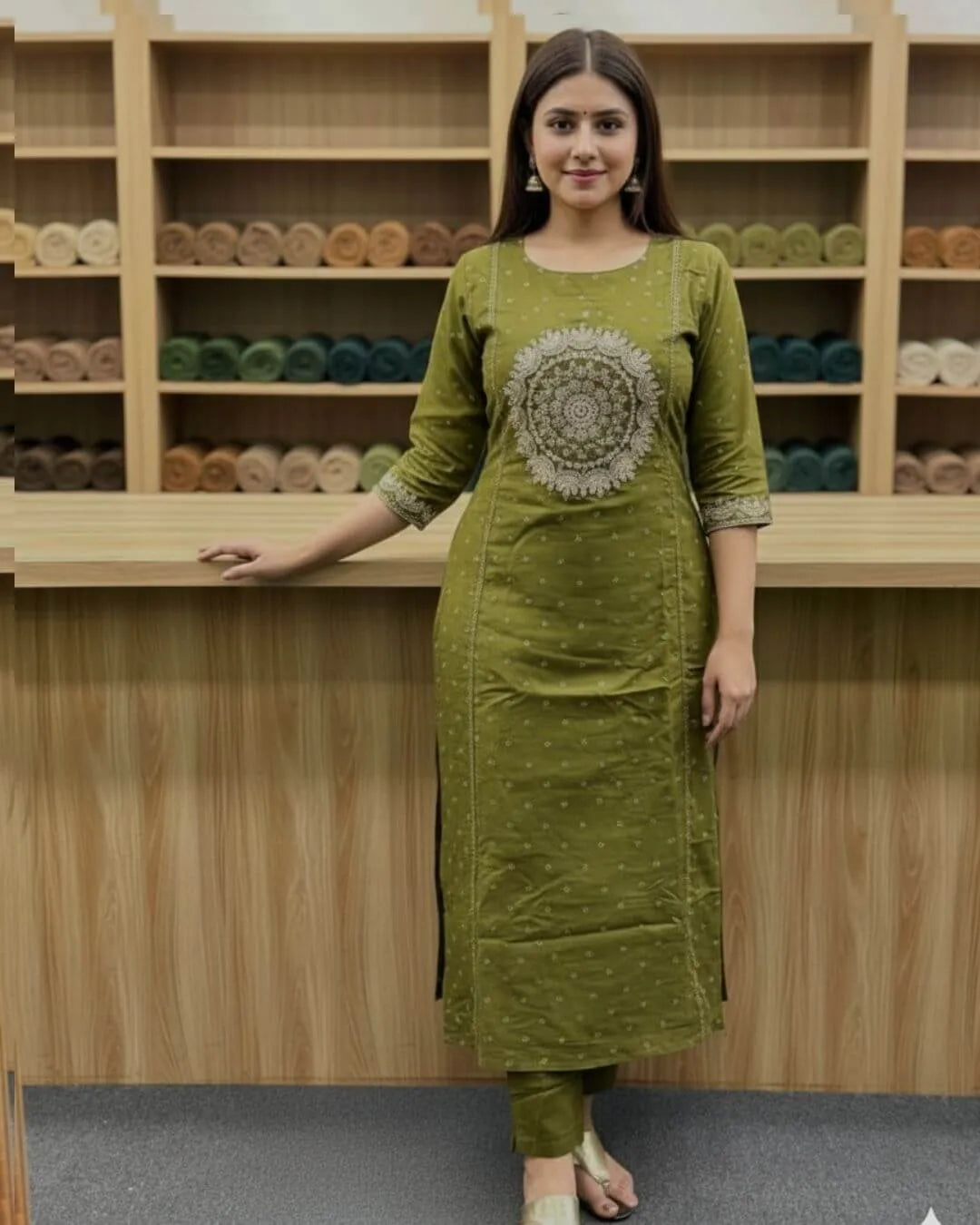 Woman wearing a green cotton kurti pant dupatta set traditional outfit