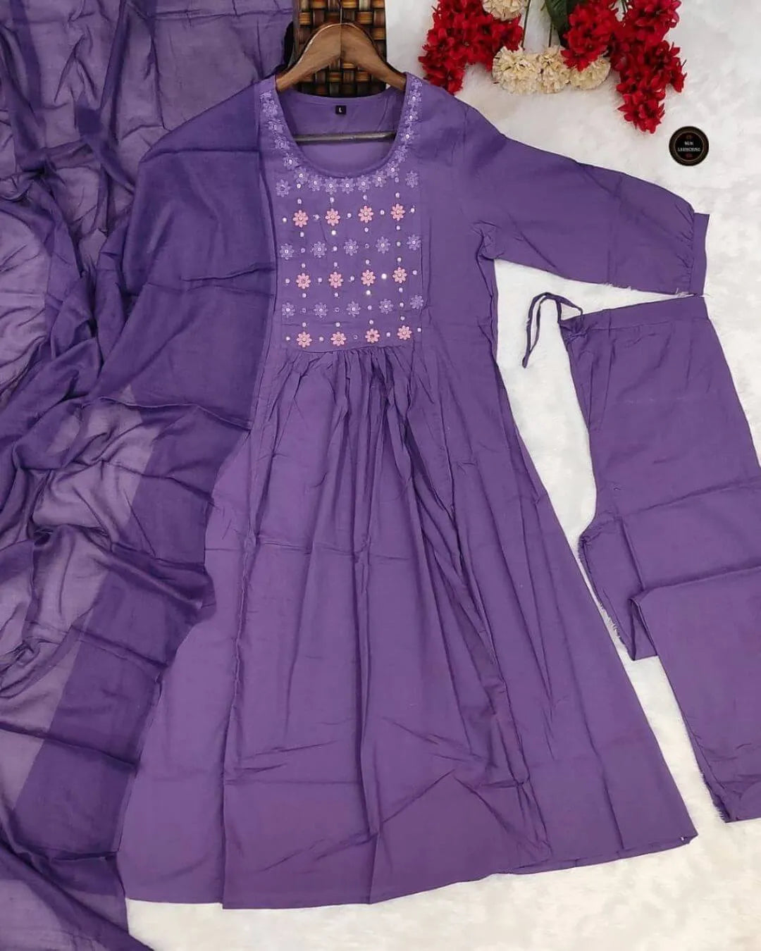 Woman wearing a Dark Purple Anarkali Dress With Dupatta Set outfit with a decorative background