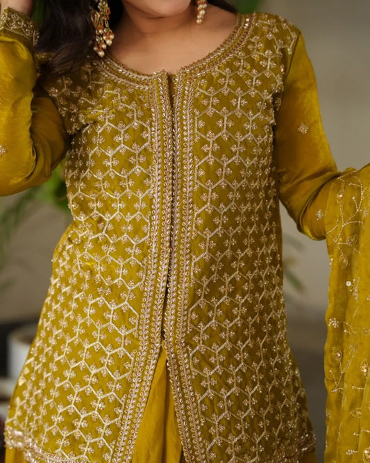 Yellow embroidered traditional outfit with intricate patterns