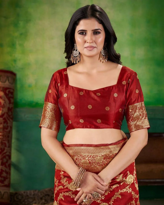 Woman wearing a red and gold traditional saree