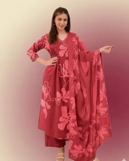 Woman wearing a Printed Cotton Anarkali Suit With Dupatta against a gradient background