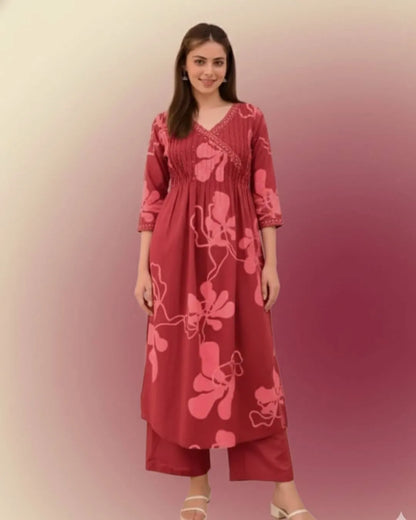 Woman wearing a Printed Cotton Anarkali Suit With Dupatta against a gradient background