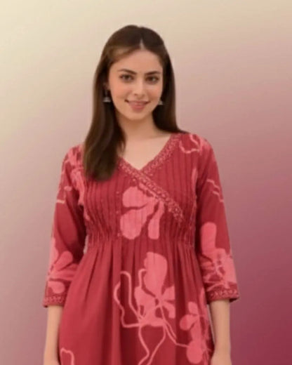 Woman wearing a Printed Cotton Anarkali Suit With Dupatta against a gradient background