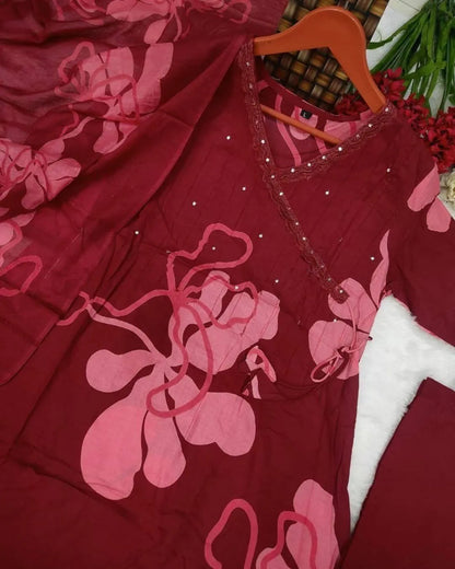 Woman wearing a Printed Cotton Anarkali Suit With Dupatta against a gradient background