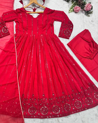 Red embroidered dress with matching pants on a white background
